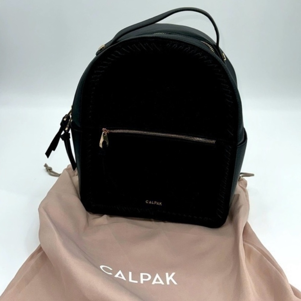 UEC Calpak Kaya faux leather travel backpack in black with gold hardware